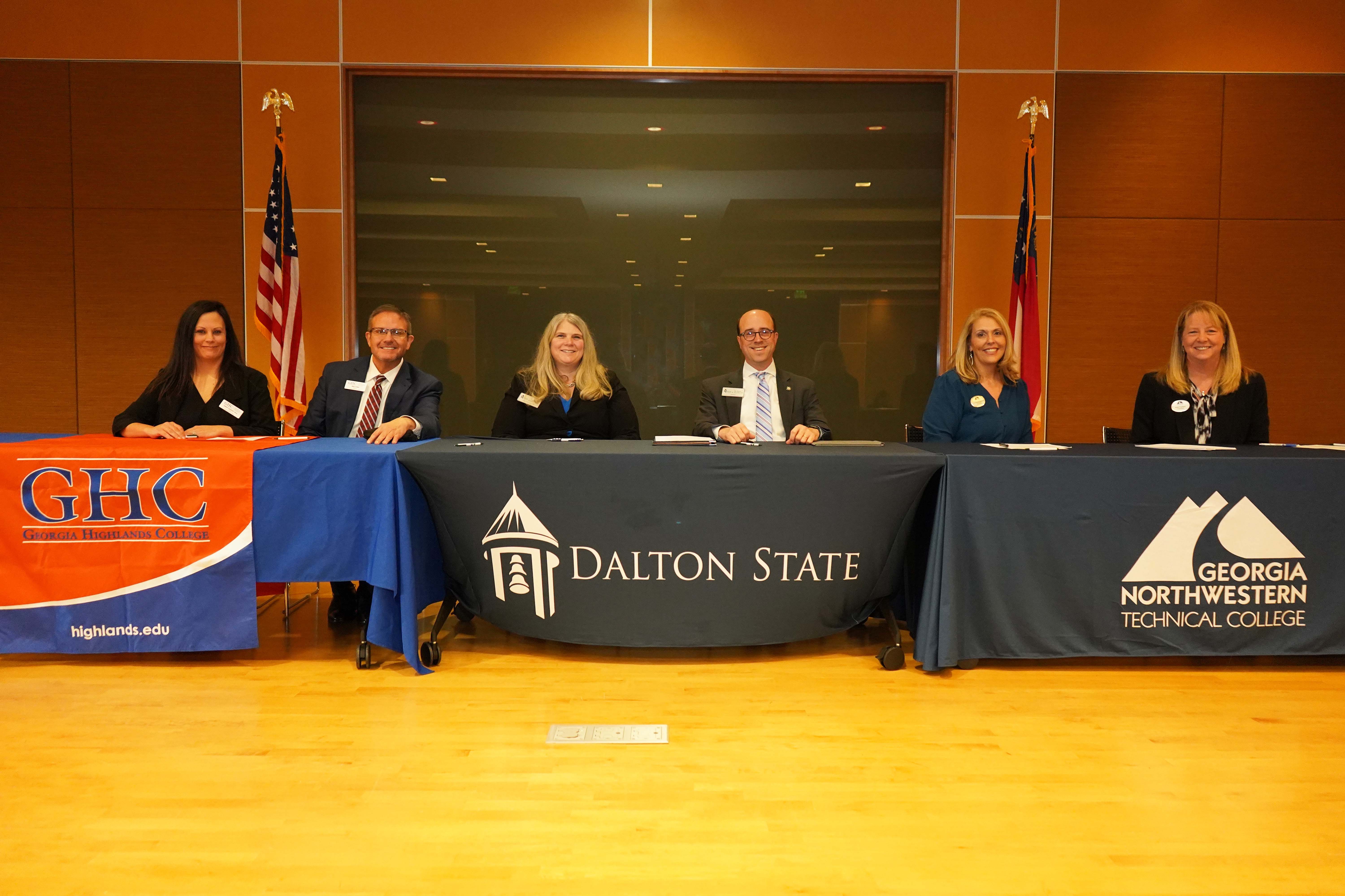 (From left) Dr. Sarah Coakley, chief academic officer/provost, and Dr. Mike Hobbs,  president, Georgia Highlands College; Dr. Gina Kertulis-Tartar, interim provost and vice president for Academic Affairs, and Dr. John Fuchko III, president, Dalton State College; and Dr. Elizabeth Anderson, vice president of Academic Affairs and Institutional Effectiveness, and Dr. Heidi Popham, president, Georgia Northwestern Technical College, prepare to sign the Northwest Georgia Connect articulation agreement.