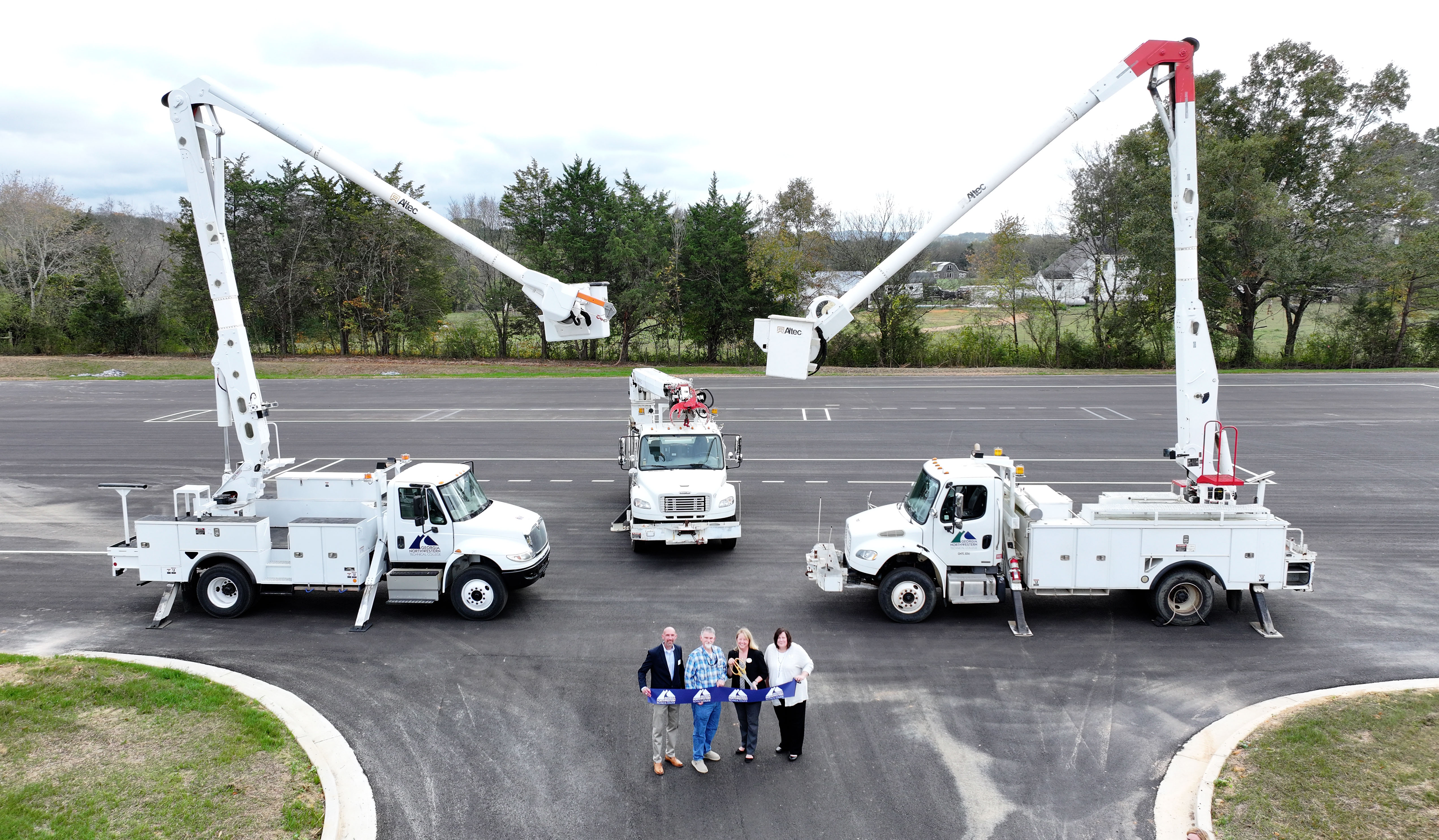  (From left) Charles Laurens, project manager with Rochester and Associates Inc.; Bryan Roberts, senior project manager with Northwest Georgia Paving Inc.; Dr. Heidi Popham, president of GNTC; and Angela Berch, vice president of Economic Development at GNTC, celebrate the completion of the second Commercial Truck Driving Range at GNTC’s Polk County Campus in Rockmart.