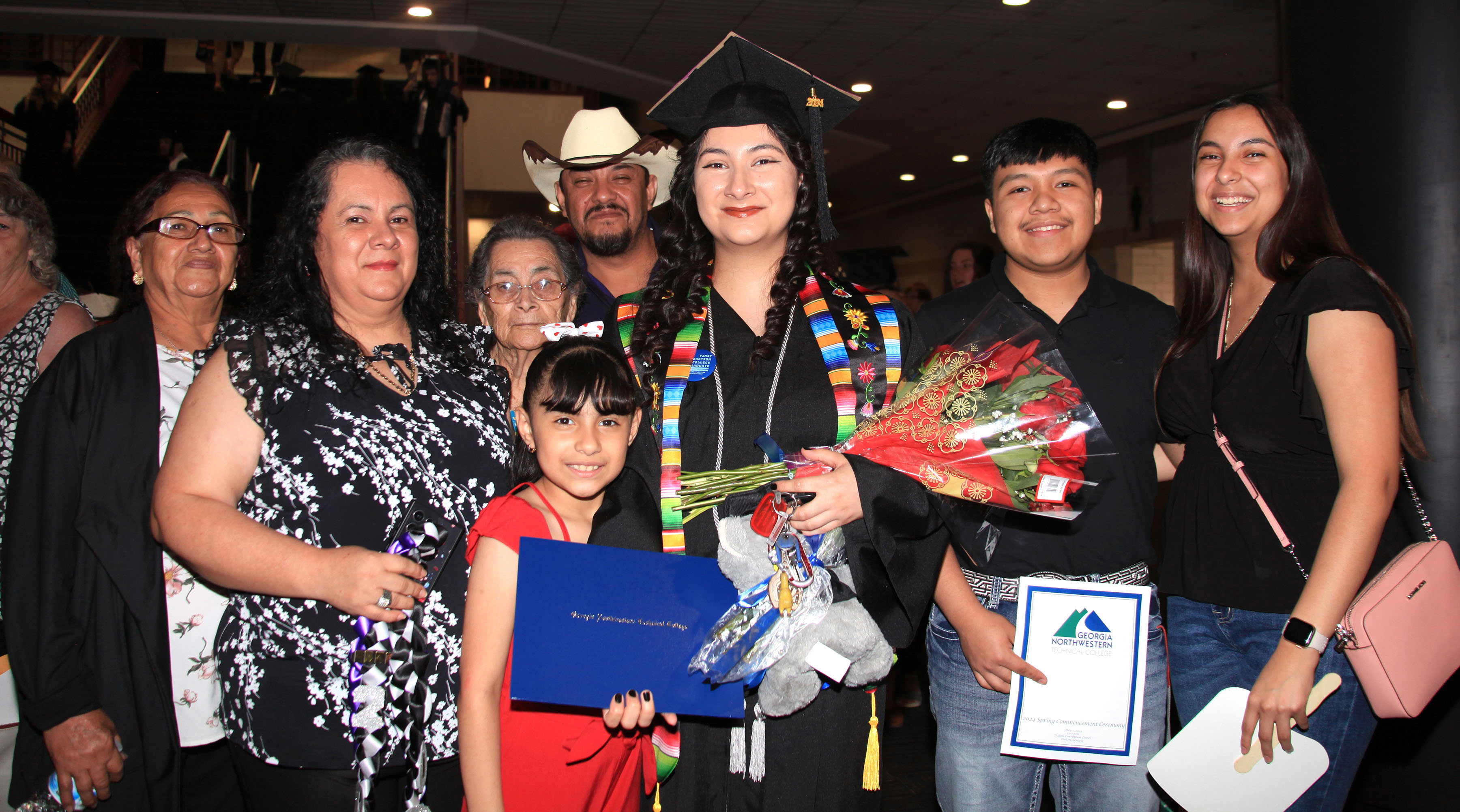 Graduate Yosdel Lizbeth Castaneda’s family celebrates with her. (From left, front) Carmela Martinez, Norma Martinez, Brizeyba Castaneda, Yosdel Lizbeth Castaneda, Johan Rodriguez, Daphne Castaneda, (back) Agricola Hinojosa and Jorge Castaneda. Castaneda received a diploma in Welding and Joining Technology.