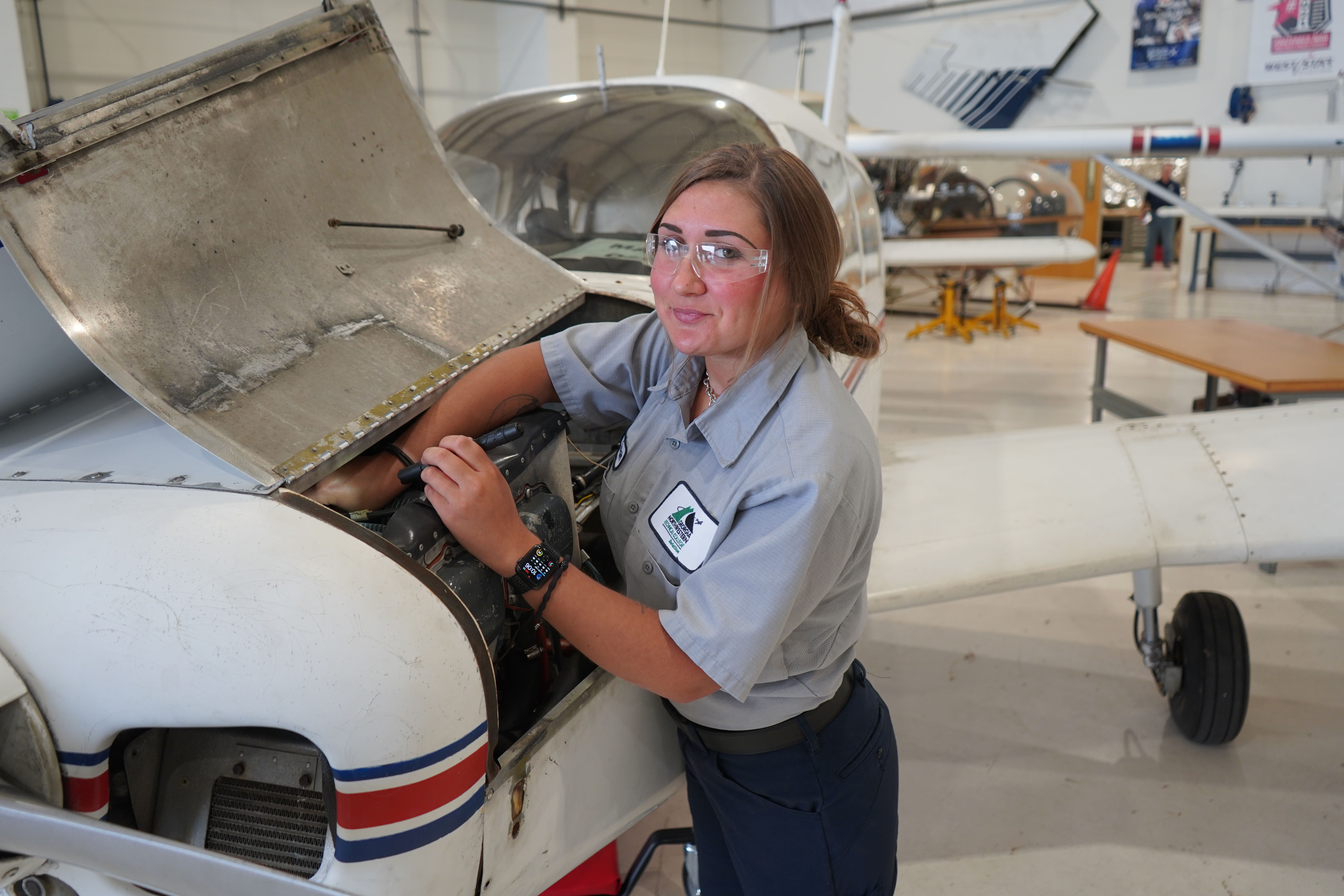 GNTC Aviation Maintenance Technology student Hannah Hembree works on an aircraft in the Aviation Training Center.