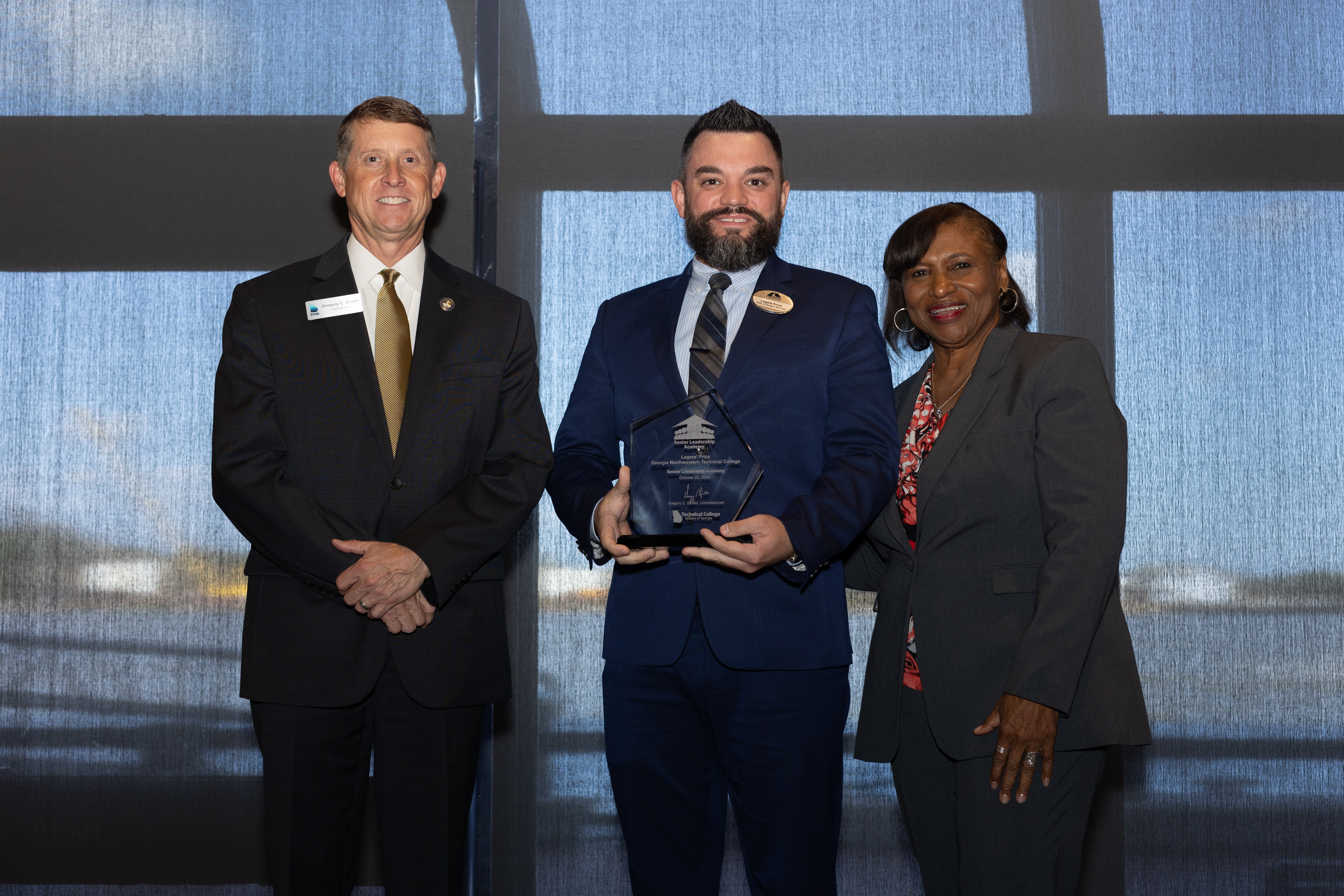 (From left) TCSG Commissioner Greg Dozier, GNTC Dean of Student Success Legare Price and TCSG President of Executive Leadership and Talent Initiatives Dr. Alvetta Thomas celebrate Price’s graduation as part of the 2024 Senior Leadership Academy class.