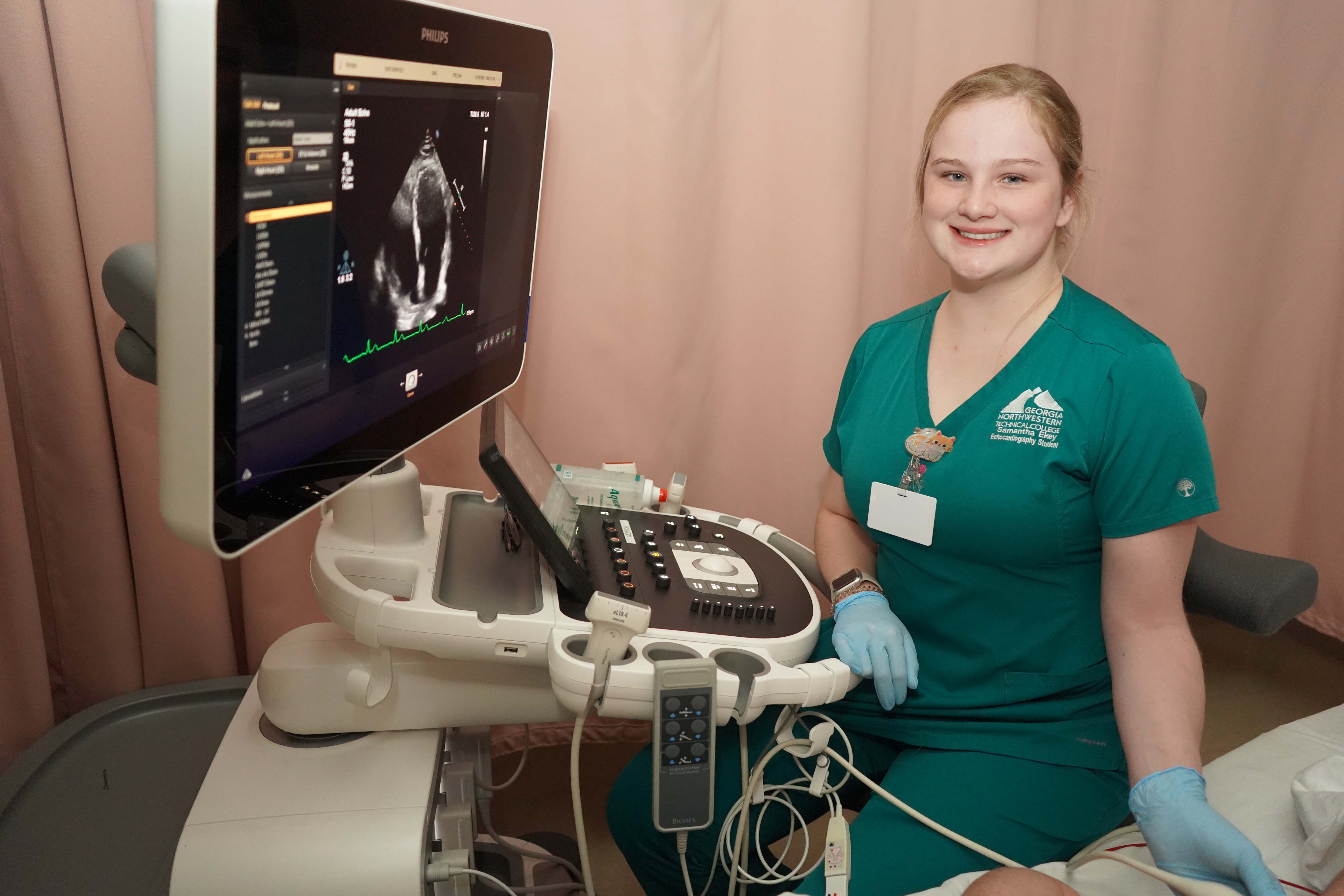 GNTC Echocardiography student Samantha “Sam” Ekey practices cardiac sonography in the Sonography programs lab at GNTC. She will cross the stage at GNTC’s 2024 Fall Commencement Ceremony at the Dalton Convention Center on Thursday, Dec. 12, at 6 p.m.